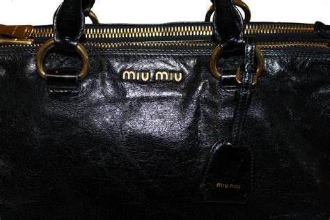 authentic miumiou logo.